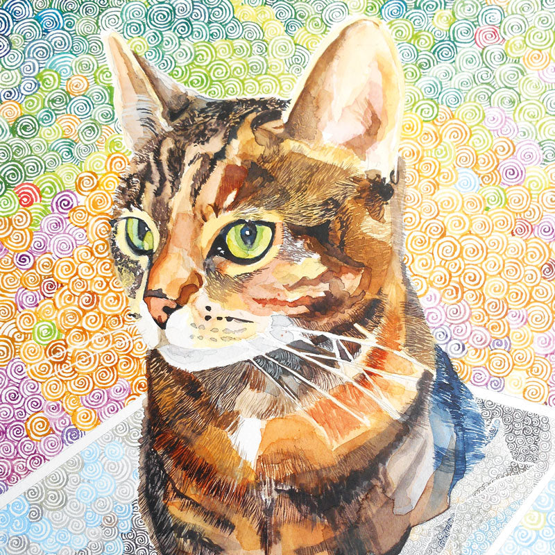 Art greeting card by Elizabeth McCrimmon, watercolour. Tabby cat with green eyes and a colourful patterned background.