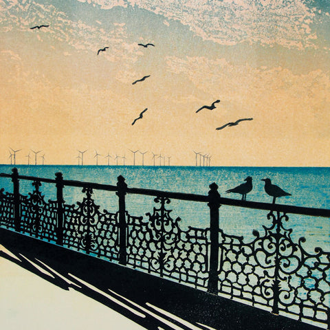 Art greeting card by Janet Brooke, linocut. Brighton sea view with wind farm and seagulls.