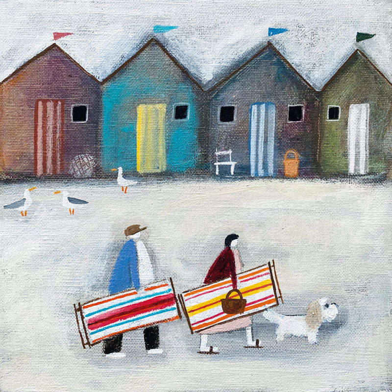 Art Greeting Card by Louise Rawlings, A couple with a dog walking past beach huts with beach chairs